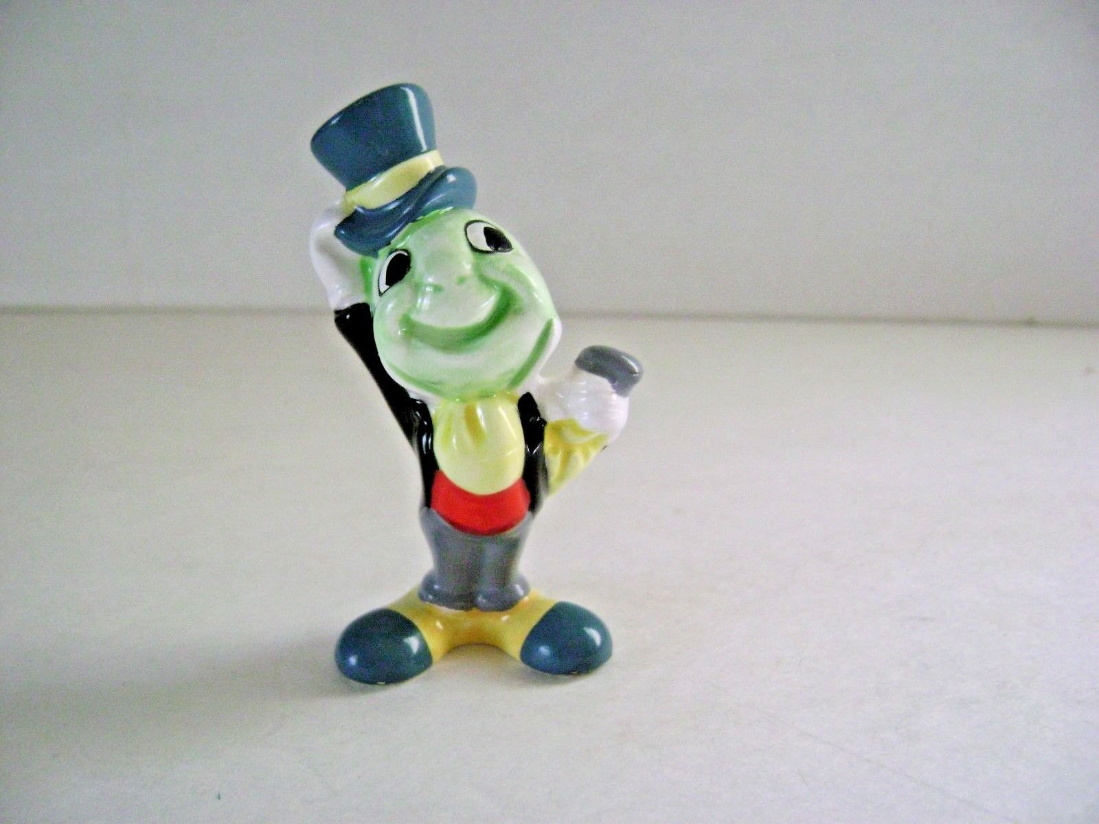 antique jiminy cricket figurine